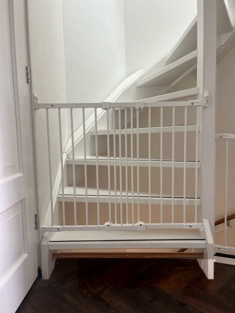 BabyDan FlexiFit stair gate mounted at an angle on bannisters